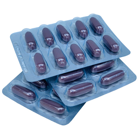 Two blue blister packs with purple capsules on a white background