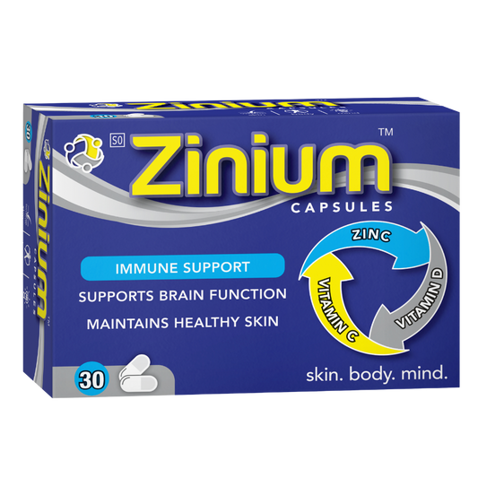 Zinium capsules packaging with blue and yellow design on a white background
